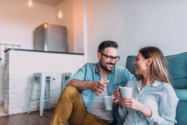 istock Couple drinking coffee at home. 1022389112
