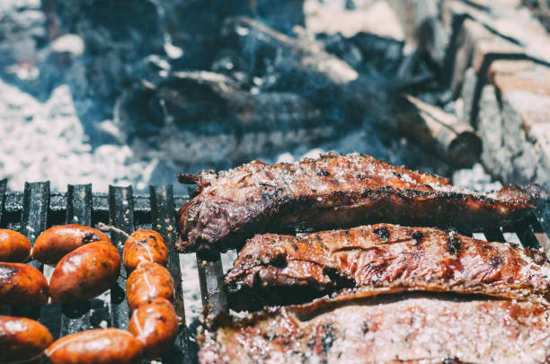 istock Lamb chops roasting in a barbecue with chourizo 1022390028