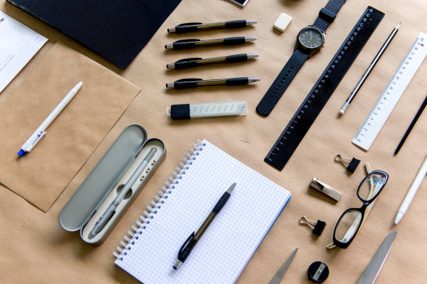 istock stationery pen scissors notebook on a wooden table 1022394866