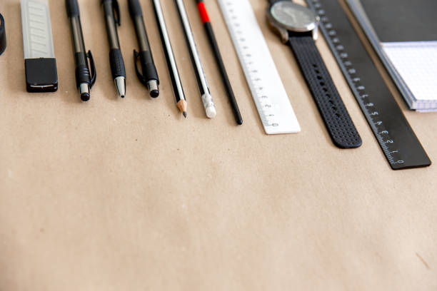 istock stationery pen scissors notebook on a wooden table 1022395142