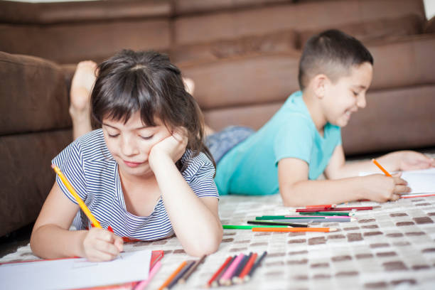 istock Brother and sister painting 1022397542