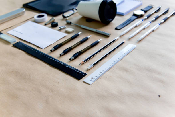 istock stationery pen scissors notebook on a wooden table 1022397726
