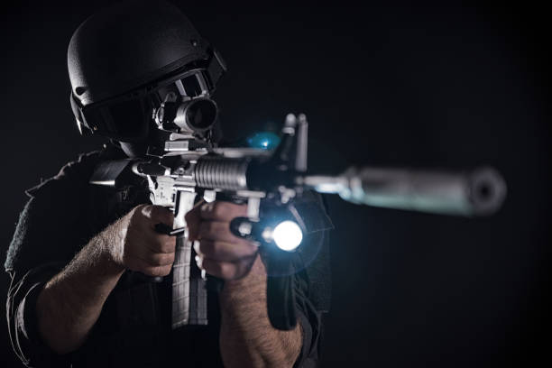 istock Spec ops police officer SWAT in black uniform 1022398050