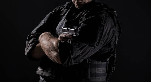 istock Spec ops police officer SWAT in black uniform 1022398074