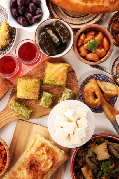 istock Middle eastern or arabic dishes and assorted meze, concrete rustic background. sambusak. Turkish Dessert Baklava with pistachio. Sarma. Halal food. Lebanese 1022408492