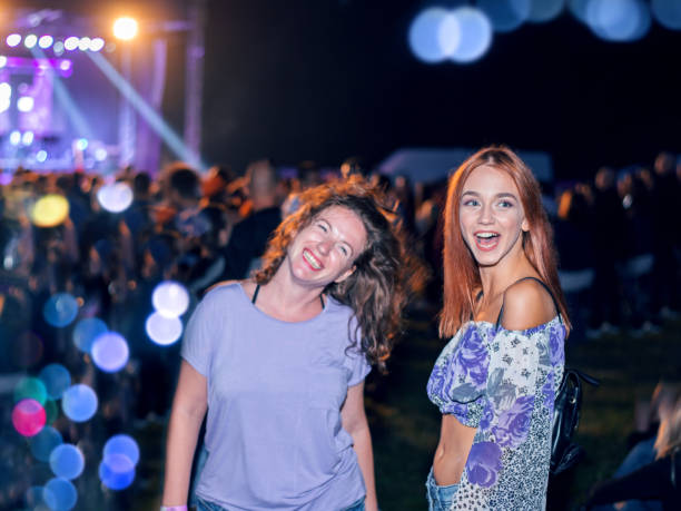 istock Young women enjoying a concert 1022408572