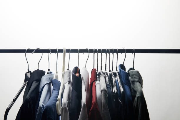 istock row of different shirts on hangers isolated on white 1022413038
