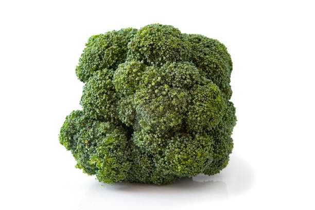 istock Broccoli head close up against white background 1022416838