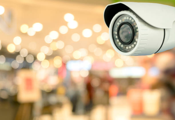 CCTV security with shop store blurry background. stock photo