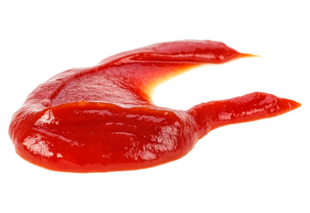 istock Tasty ketchup tomato sauce isolated over white background 1022424906