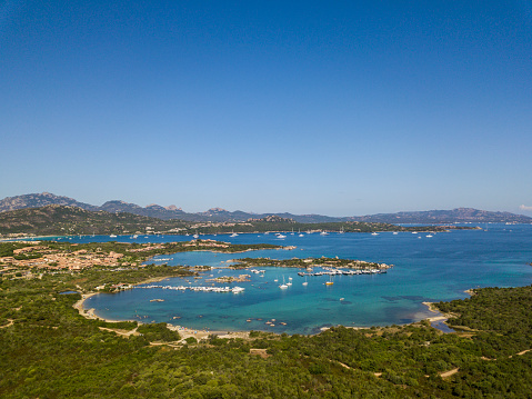 Aerial view of the village and the famous Sardinia, Sardinia, Italy. Sardinia is a small stretch in the comune of Arzachena, in the province of Sassari. Created by Prince Karim Aga Khan and various other investors, Porto Cervo is the main centre of Sardinia. Porto Cervo is one of the most expensive locations in Europe, along as being a luxury yacht magnet and billionaires' playground.