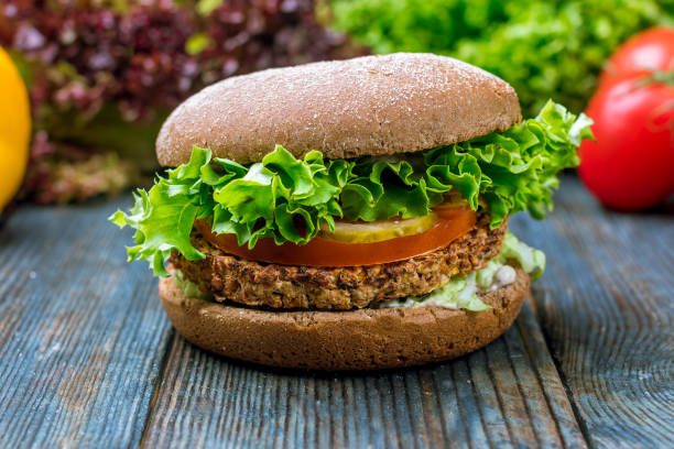 vegetarian Burger with a Patty made of buckwheat vegetarian Burger with a Patty made of buckwheat veggie burger photos stock pictures, royalty-free photos & images