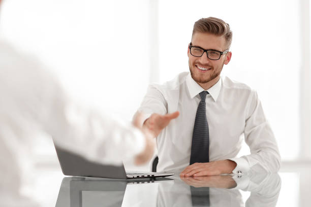 istock Manager welcomes the employee with a handshake 1022440016