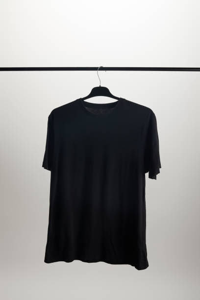istock one black shirt on hanger isolated on white 1022443724