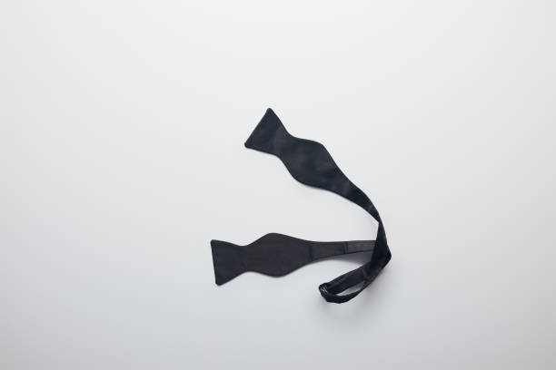 白で隔離アンタイド黒の蝶ネクタイの平面図 - ほどけた ストックフォトと画像
