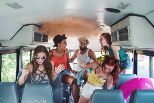 istock Group of young people having fun, party bus 1022456832