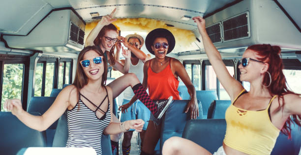 istock Group of young people having fun, party bus 1022456982