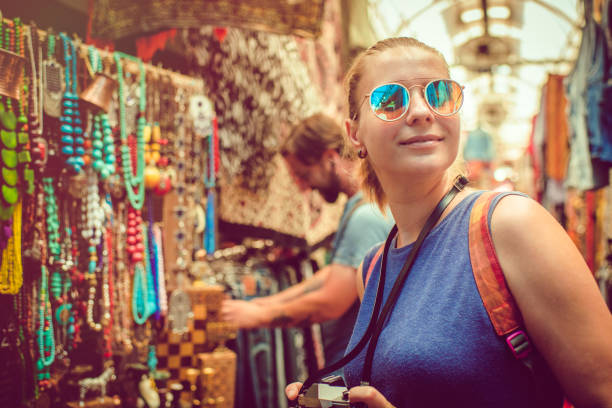 istock Couple discover souvenirs market while travelling 1022457140