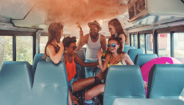istock Group of young people having fun, party bus 1022470658