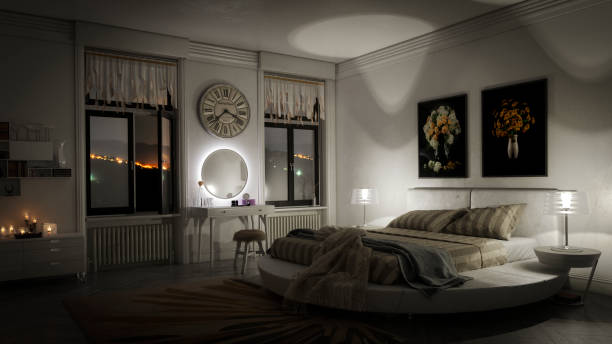 Stylish Bedroom Interior Digitally generated luxurious domestic bedroom interior (night scene).

The scene was rendered with photorealistic shaders and lighting in Autodesk® 3ds Max 2016 with V-Ray 3.6 with some post-production added. low lighting stock pictures, royalty-free photos & images