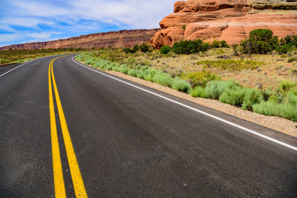 istock Winding Utah road, mountains, double yellow lines 1022476934