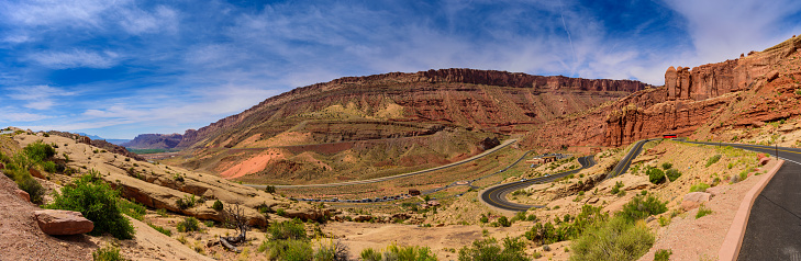 Winding Utah road, mountains, double yellow lines, panorama