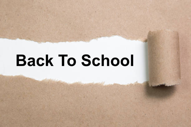 istock The word Back To School appearing behind torn paper 1022480830