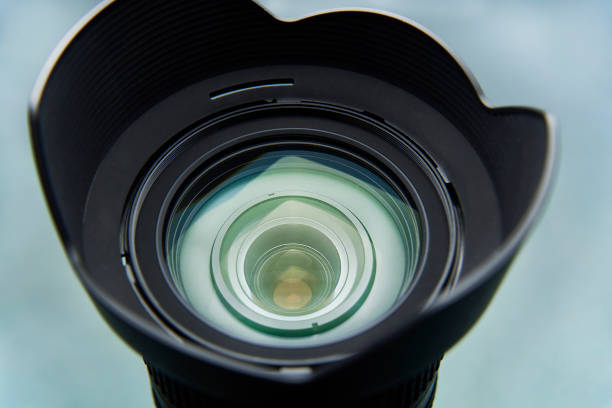 istock Camera lens with a blend close-up on a light background. 1022489460