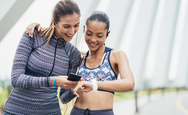 istock Two female athletes compare their results 1022500168