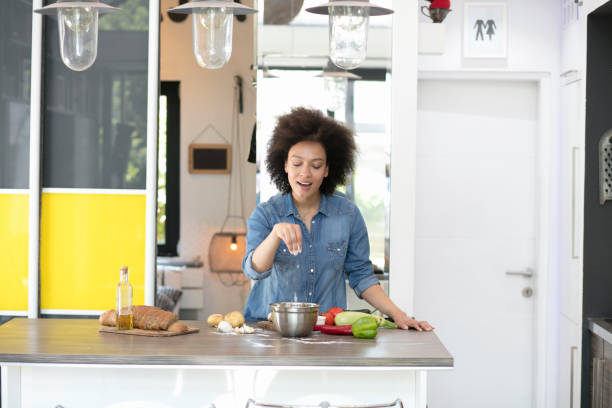 istock Beautiful mixed race woman in kitchen 1022500694