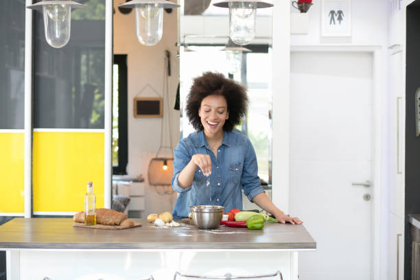 istock Beautiful mixed race woman in kitchen 1022502884