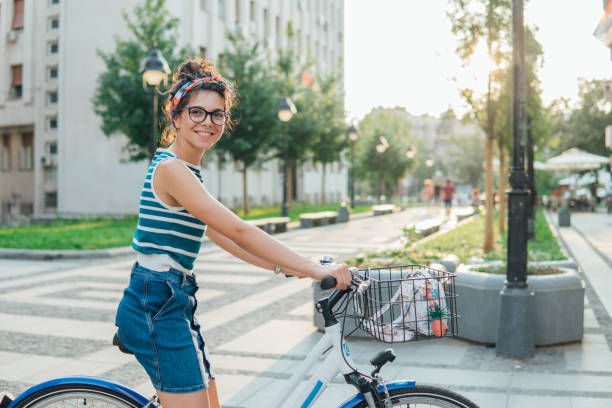 istock Smiling girl on a bicycle 1022503104
