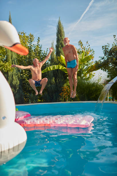 istock Senior Friends Pool Fun 1022503280