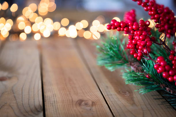 istock Christmas Holly on Wood Background 1022505796
