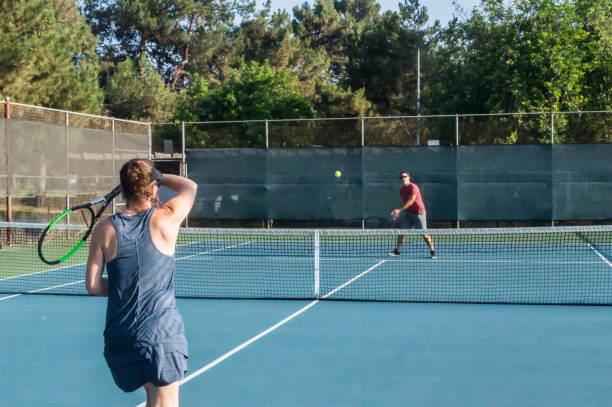 istock Mixed doubles tennis lesson 1022505918