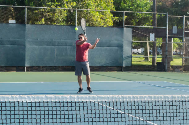 istock Mixed doubles tennis lesson 1022505938