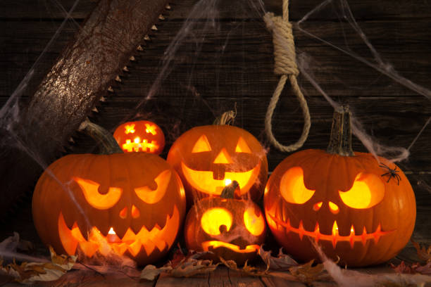 istock Halloween pumpkin head jack on wooden background 1022527150