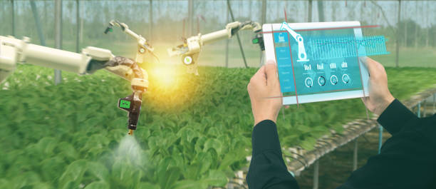 istock iot smart industry robot 4.0 agriculture concept,industrial agronomist,farmer using software Artificial intelligence technology in tablet to monitoring condition and control automatic robotics in farm 1022530856