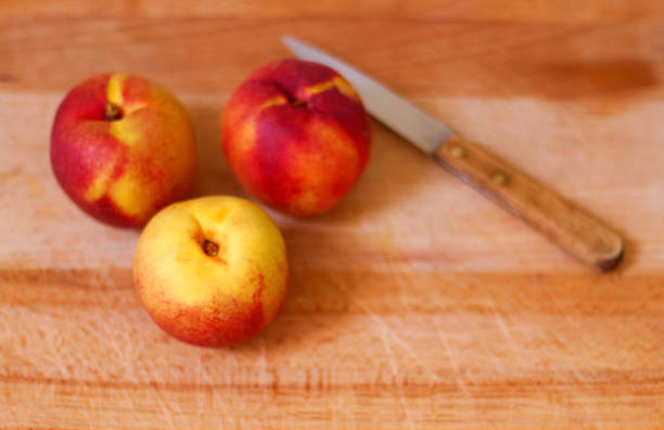 istock Fresh, organic apricots on a wooden chopping board 2 1022536272