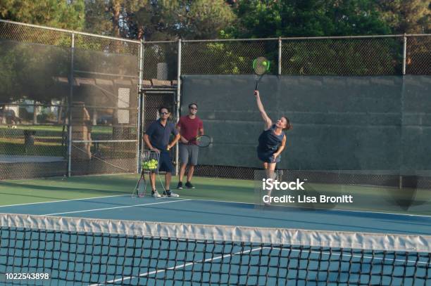 Mixed Doubles Tennis Lessons Stock Photo - Download Image Now - Active Lifestyle, Adults Only, Athlete