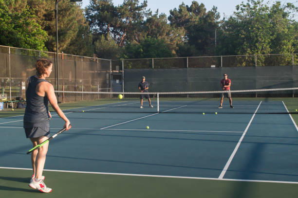 istock Mixed doubles tennis lessons 1022544022
