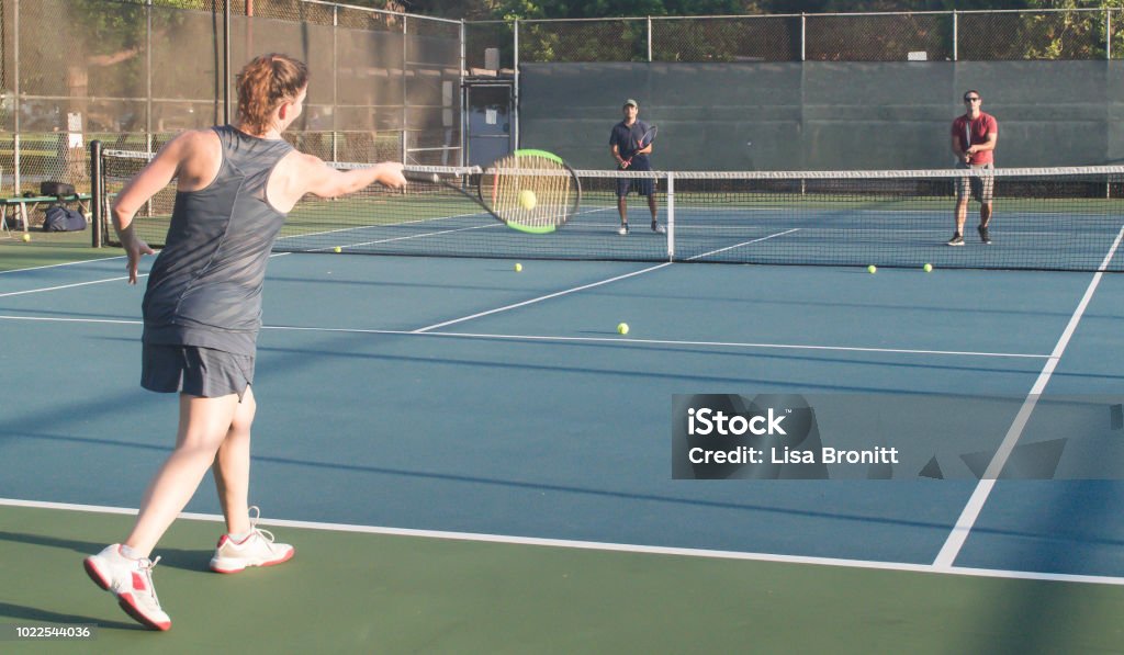 Mixed doubles tennis lessons Mixed doubles tennis lesson in summer in Los Angeles Tennis Stock Photo