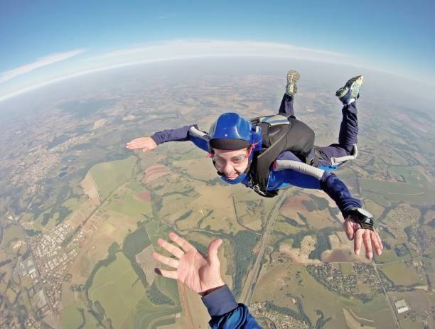 istock Happy parachutist smiling in freefall 1022544244