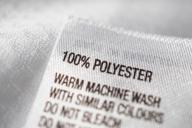 Polyester fabric Clothing label with laundry instructions Polyester fabric Clothing label with laundry instructions polyester photos stock pictures, royalty-free photos & images