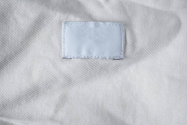 istock White blank laundry care clothes label on cotton shirt 1022551630