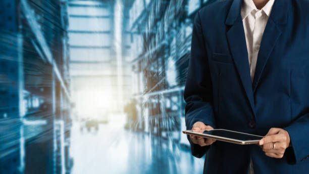 istock Business Logistics concept, Businessman manager using tablet check and control for workers with Modern Trade warehouse logistics. Industry 4.0 concept 1022551980