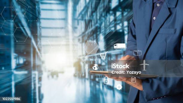 Business Logistics Concept Businessman Manager Using Tablet Check And Control For Workers With Modern Trade Warehouse Logistics Industry 40 Concept Stock Photo - Download Image Now