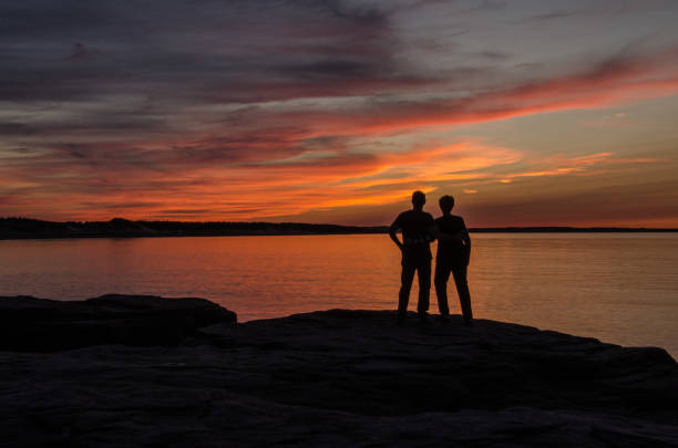 istock A couple watch Maritime Romantic Red Sunset 1022562918