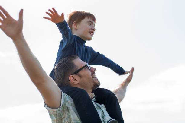 istock young father and son have fun and fly 1022565618