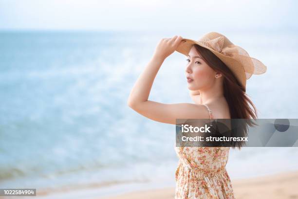 Young Asian Woman With Hat Enjoying At The Beach Summervacation And Holiday Concept Stock Photo - Download Image Now
